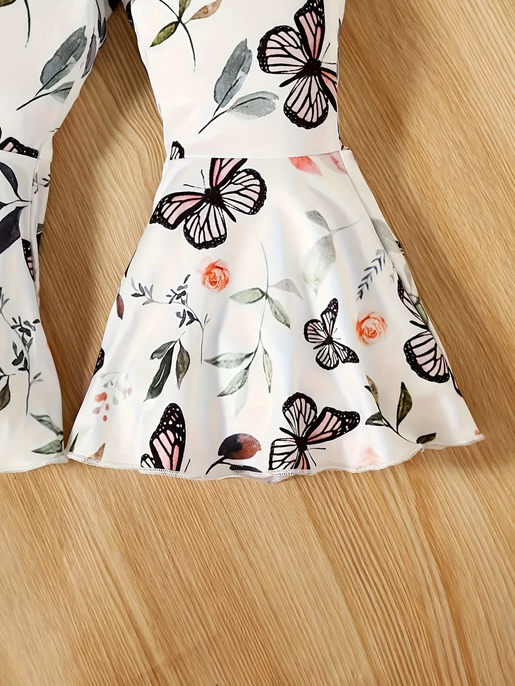 Baby Girl Outfit Set with a Pink Bow Front Bodysuit and Butterfly Flared Pants for Coordinated Daytime Wear