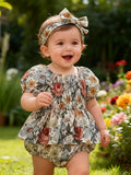 Baby Girls' Floral Romper Outfit with Puff Sleeves and a Smocked Bodice, Including a Matching Headband