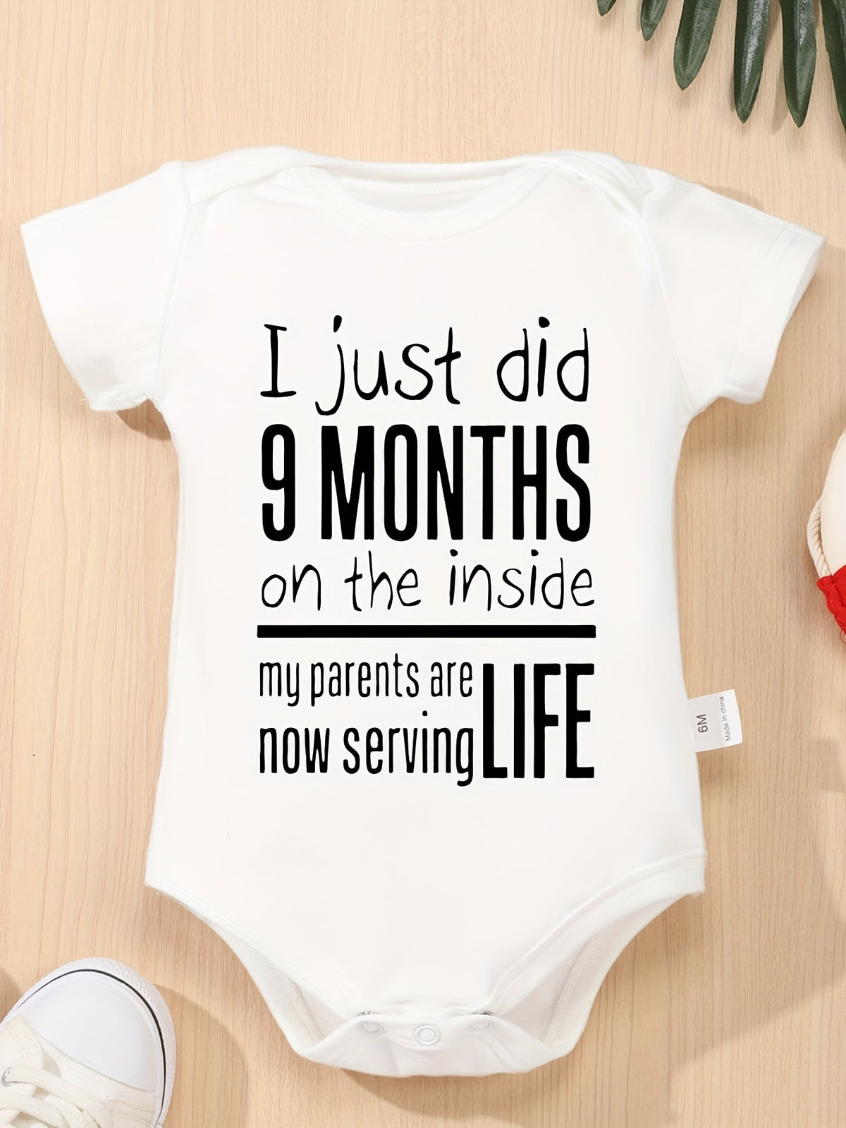 Baby Nine Months Slogan Bodysuit in White with Short Sleeves and Crotch Snaps for a Funny Everyday Outfit