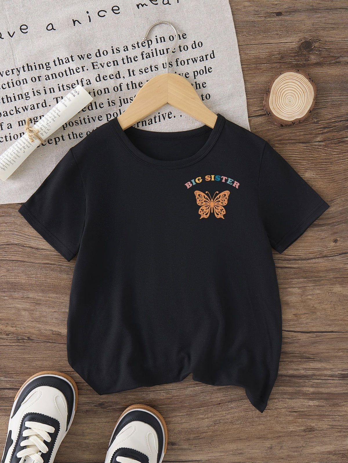 Girls' In My Big Sister Era T-Shirt in Black with a Butterfly Chest Print and Colorful Back Lettering
