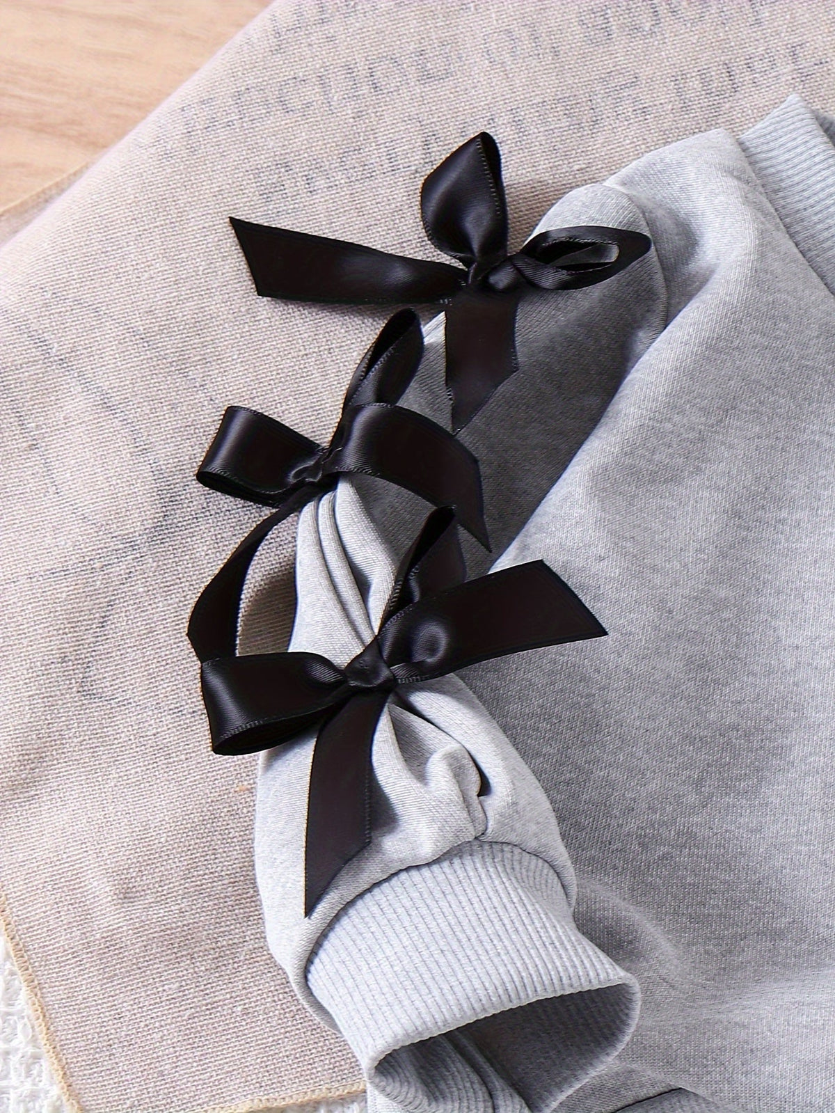 Baby Girls' Gray Sweatshirt and Pants Set with Black Bow Sleeves and Ribbed Cuffs for Everyday Wear