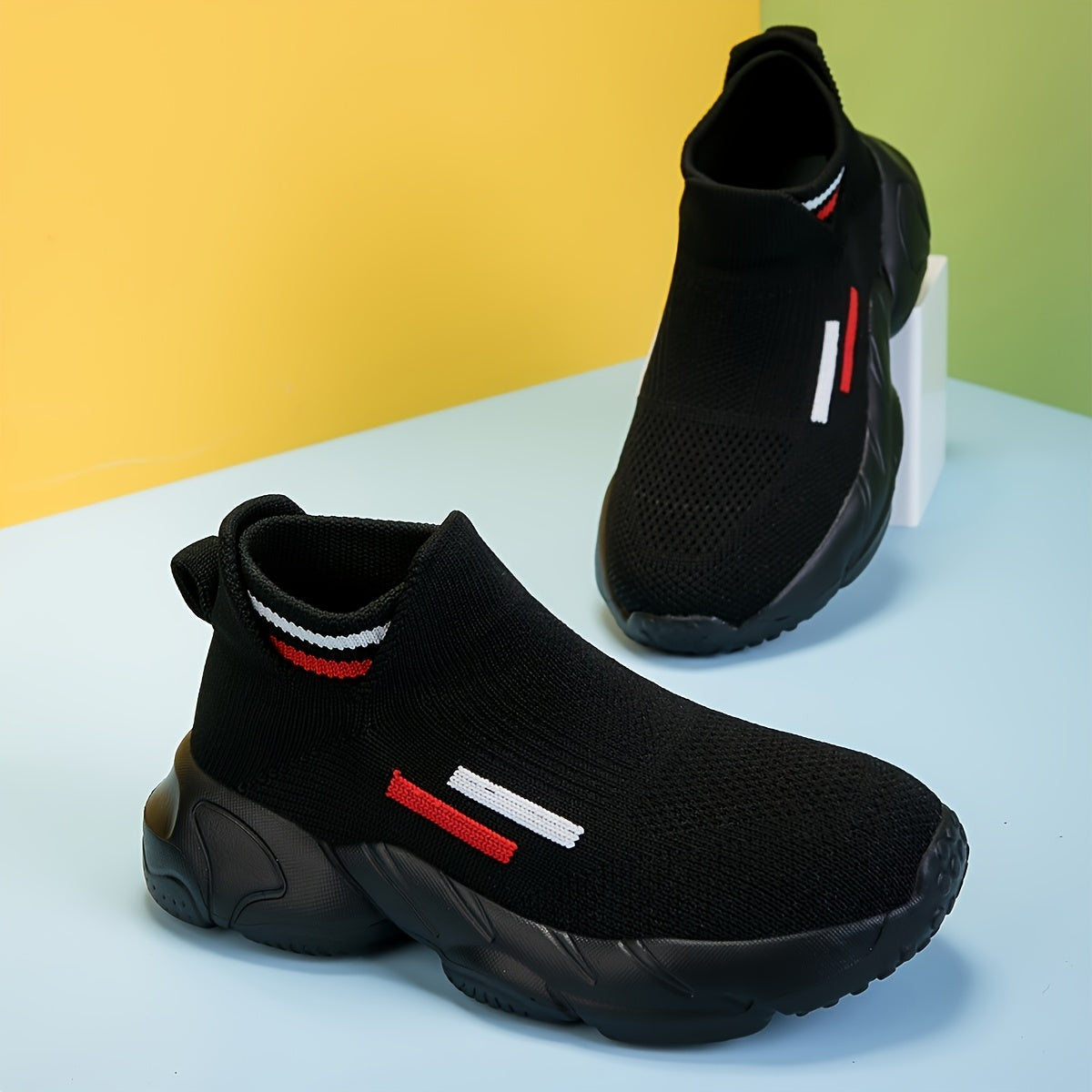 Kids' Slip-On Sneakers in Black Knit with Sock Cuffs and Striped Pull Tabs for Everyday Casual Outfits